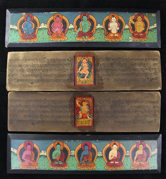 A Tibetan painted wood and leaf sutra, first half 20th century, 9.5 x 36.5cm